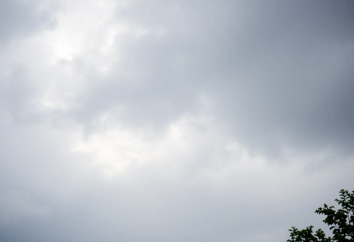 Cloudy sky with light rain falling