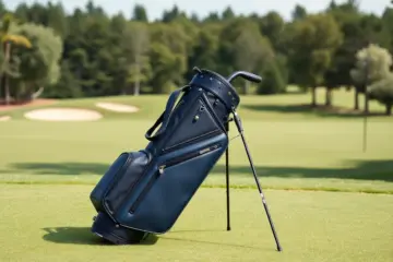 Ping Reserve stand bag in navy blue on a golf course